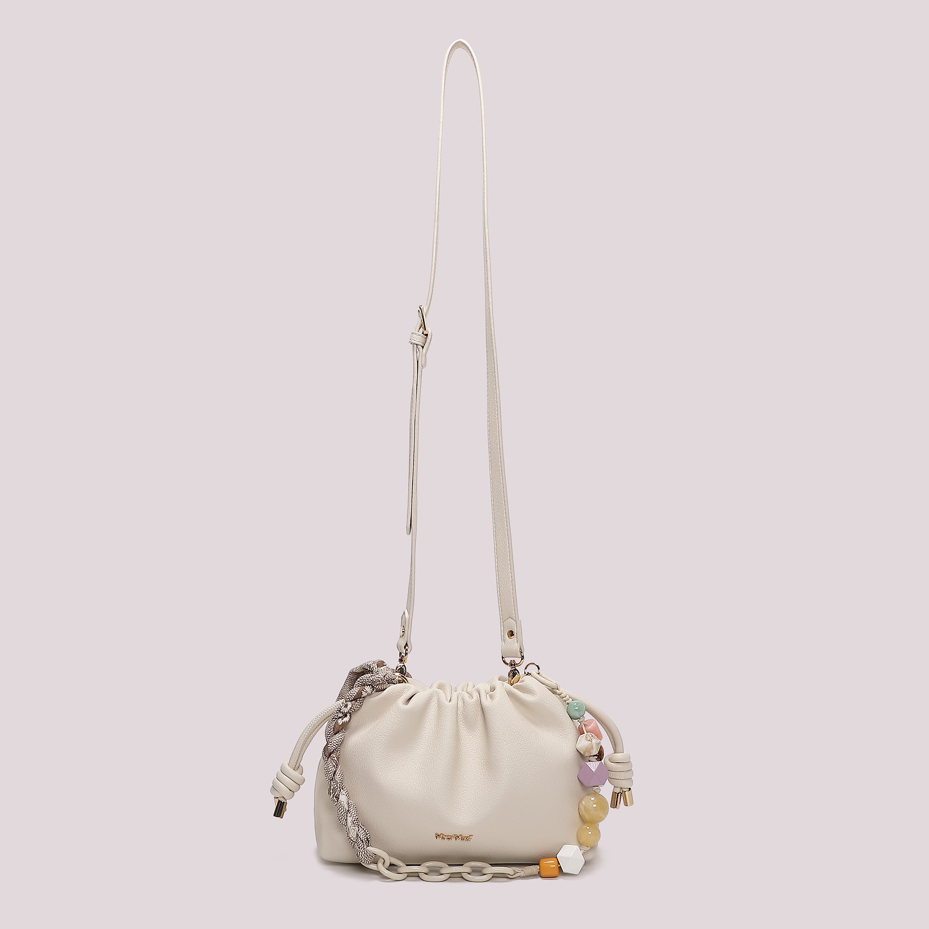 Borsa tracolla Mimi Mua morbida con chiusura a coulisse e dettagli decorativi