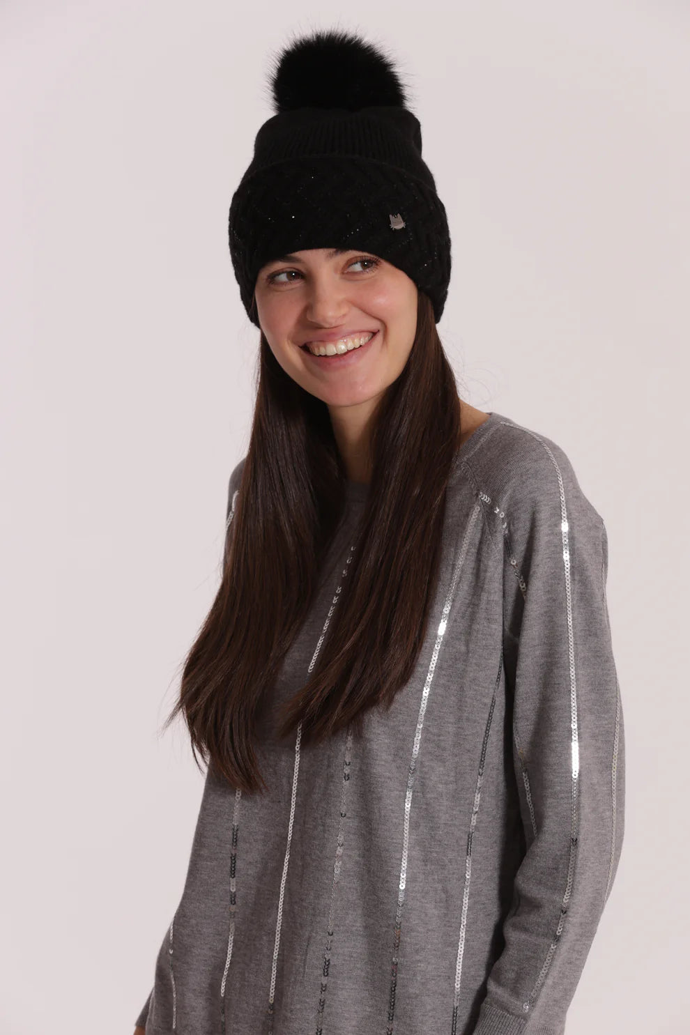 Cappello donna Mimi Mua con pon pon e lavorazione a trecce