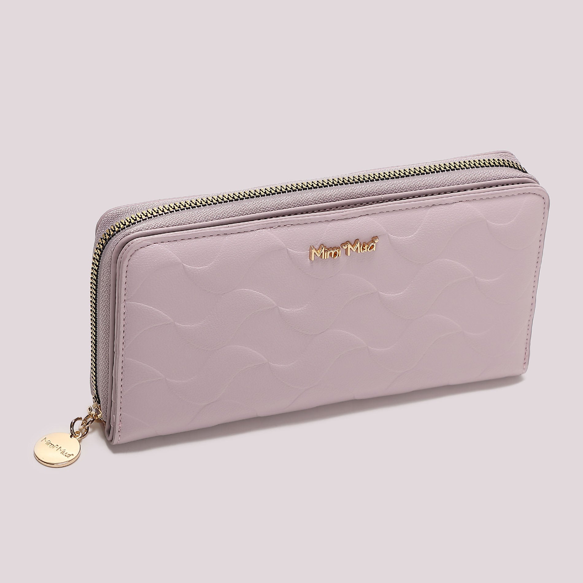 Portafoglio donna Mimi Mua grande zip around con motivo trapuntato elegante Lilla TU | Giò Fashion