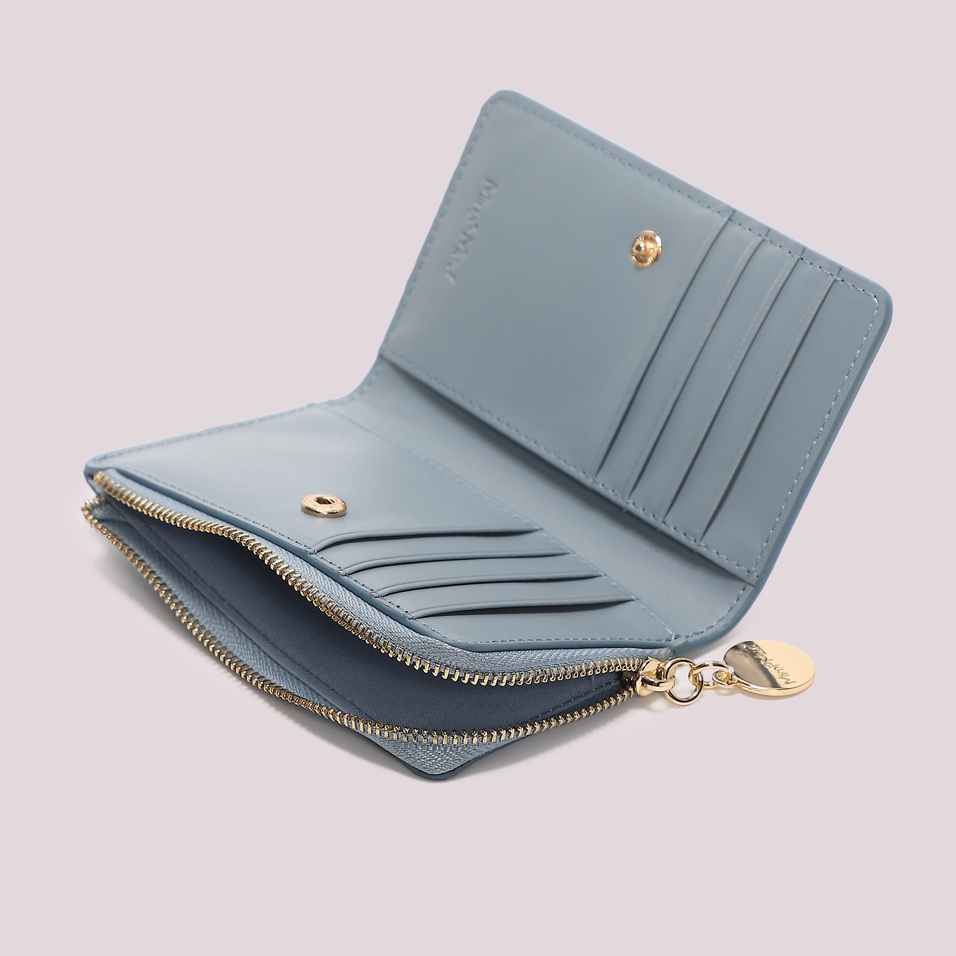 Portafoglio donna Mimi Mua con zip compatto e design elegante minimal CELESTE TU | Giò Fashion